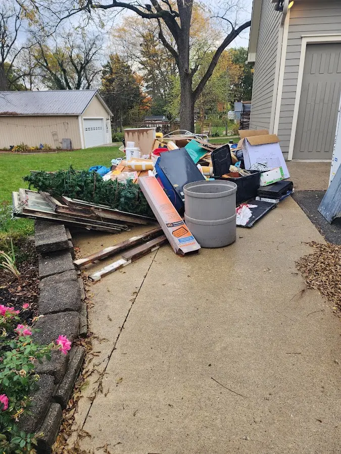 Dumpster being loaded with debris for Demolition Dumpster Rental in Ville Platte